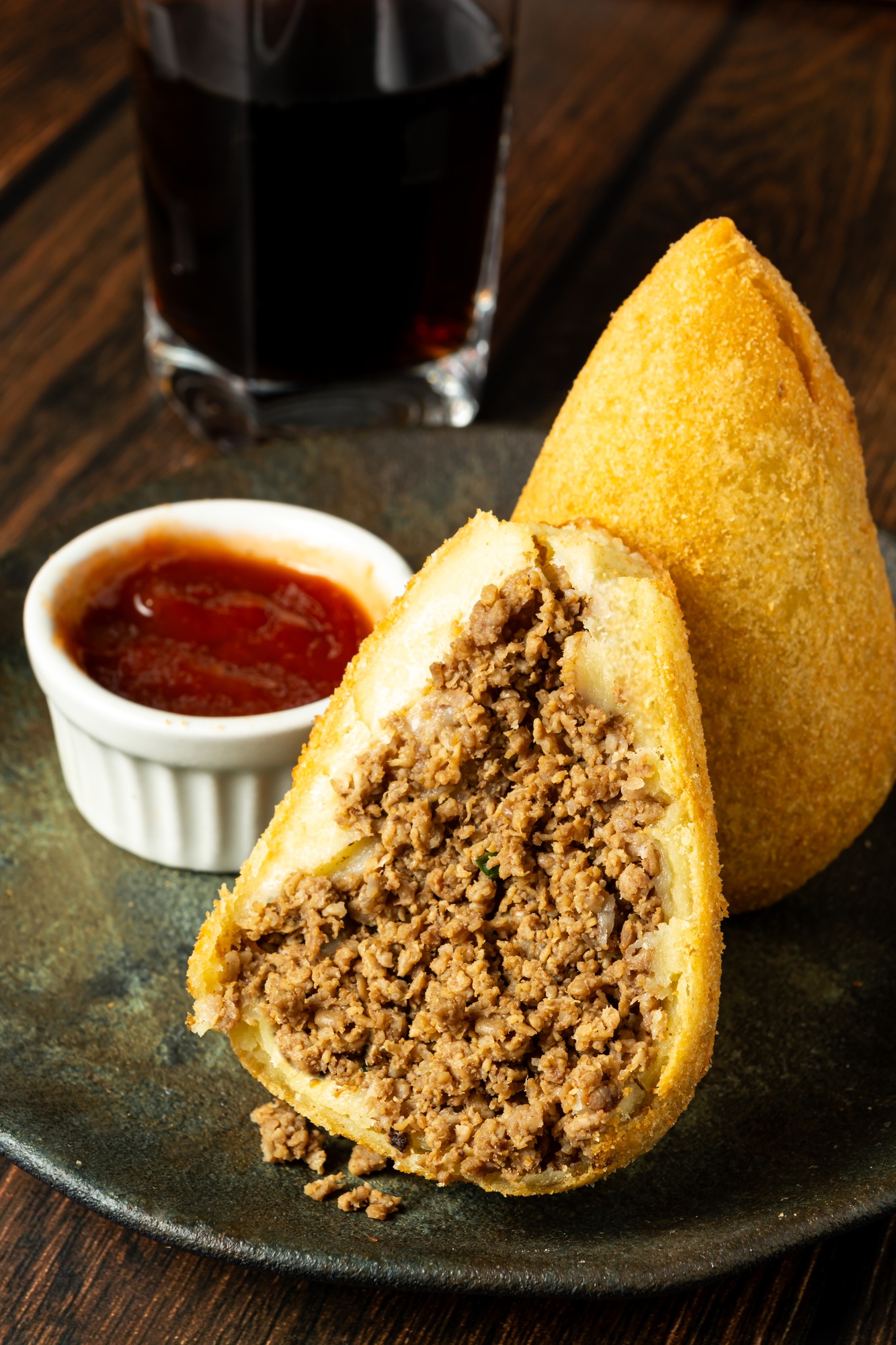 two traditional Brazilian coxinhas. typical fried snack food stuffed with meat and chicken